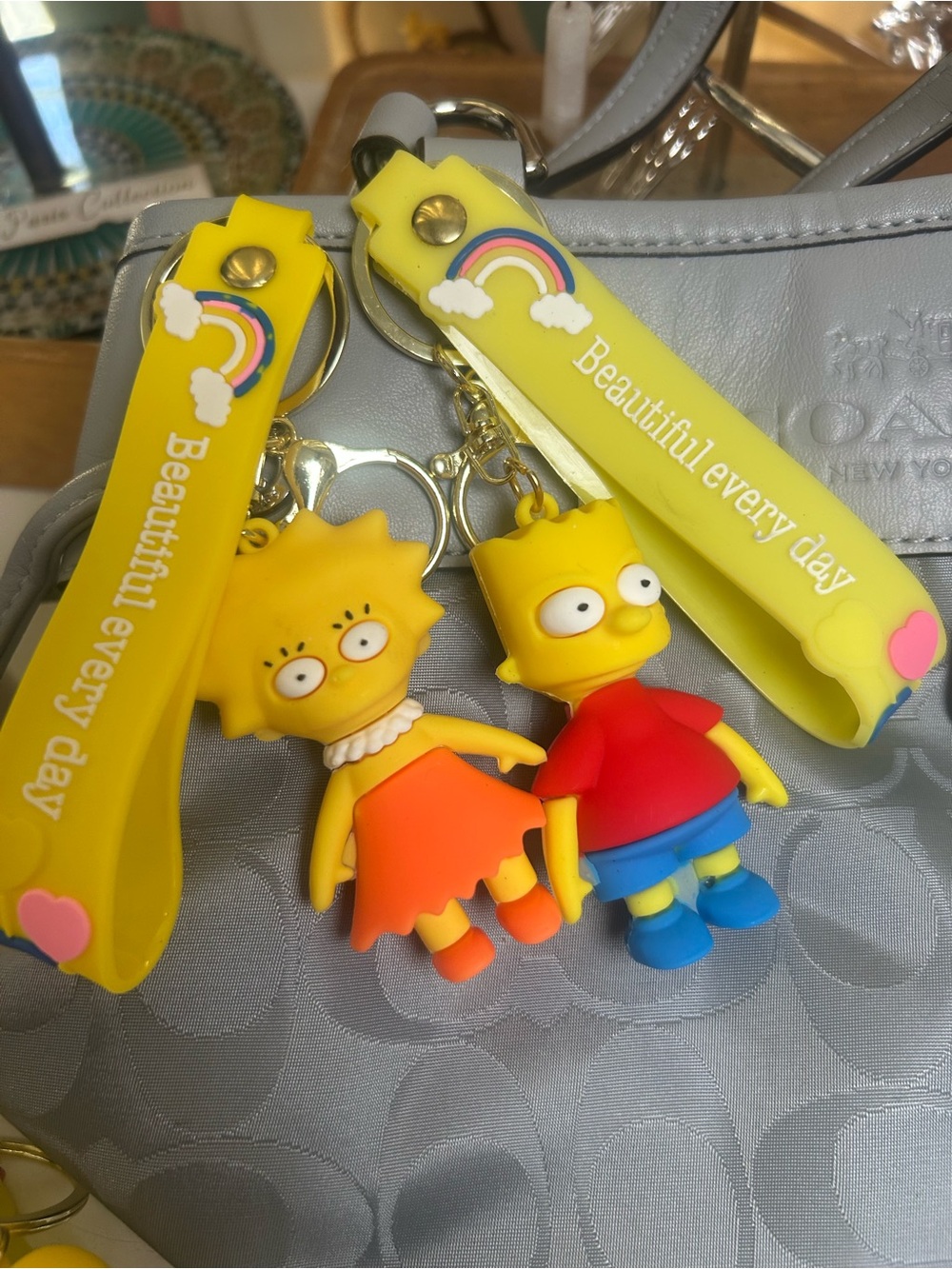 Lisa & Bart Simpson Yellow Rubber Keychain Set with Rainbow Strap